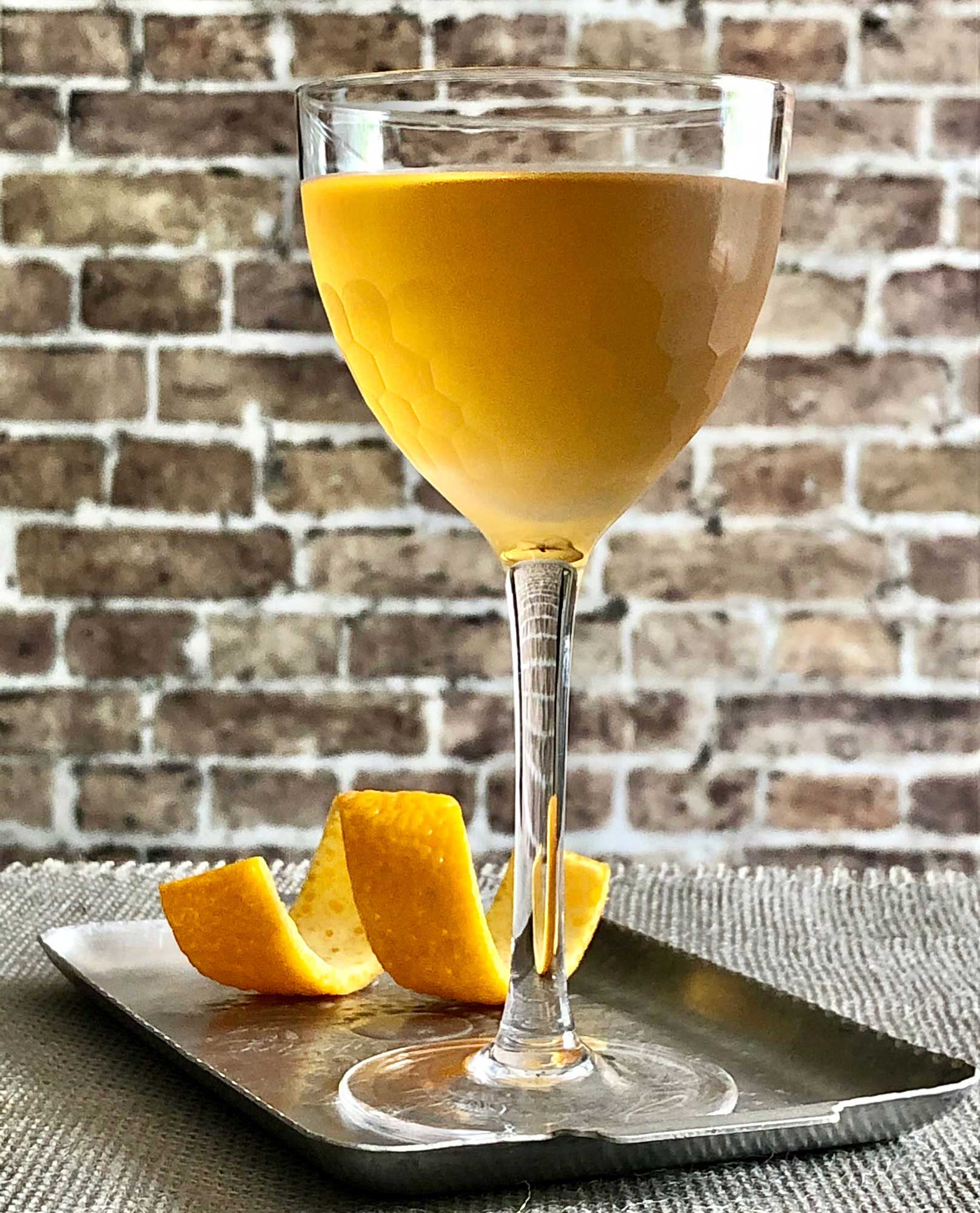 An example of the Aviators on Fire, the mixed drink (cocktail), Adapted from Chuck Kerwood, featuring cognac, Dolin Dry Vermouth de Chambéry, and Pierre Ferrand Ancient Formula Orange Curaçao; photo by Lee Edwards