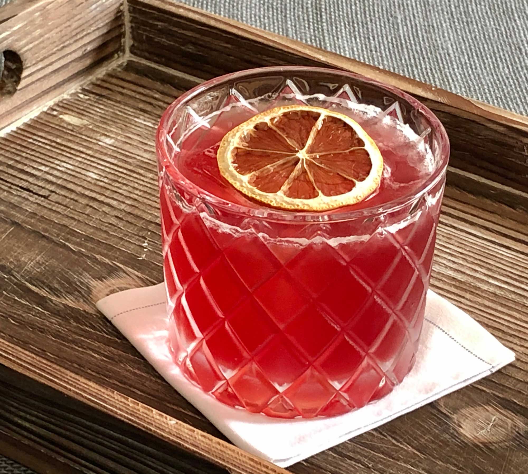 An example of the Lion in Winter, the mixed drink (cocktail) featuring bourbon whiskey, lemon juice, Rothman & Winter Orchard Elderberry Liqueur, and rich simple syrup; photo by Lee Edwards